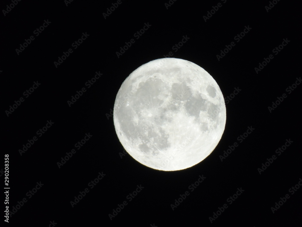 Genova, Italy - 09/13/2019: An amazing photography of the full moon over the city of Genova by night with a great clear sky in background and some stars Genova, Italy - 09/13/2019: An amazing photography of the full moon over the city of Genova by night with a great clear sky in background and some stars