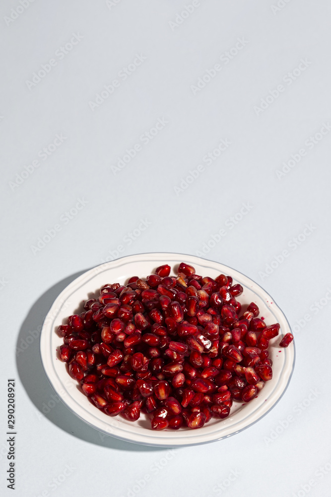 High angle view of pomegranate seeds on plate High angle view of pomegranate seeds on plate
