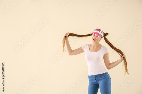 Cool young woman dancing ag...