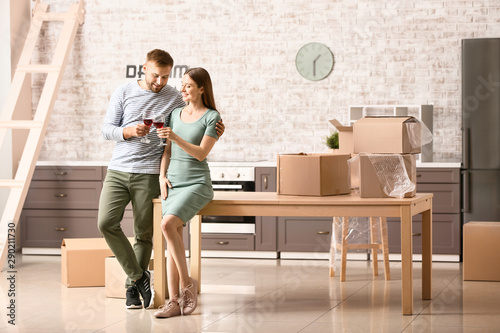 Happy young couple drinking...