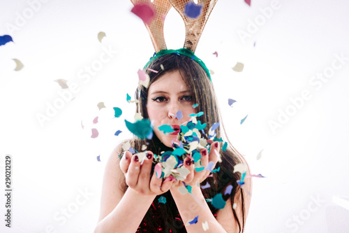 Teenage girl partying celebrating New Year's Eve