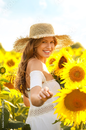 Beautiful young woman in su...