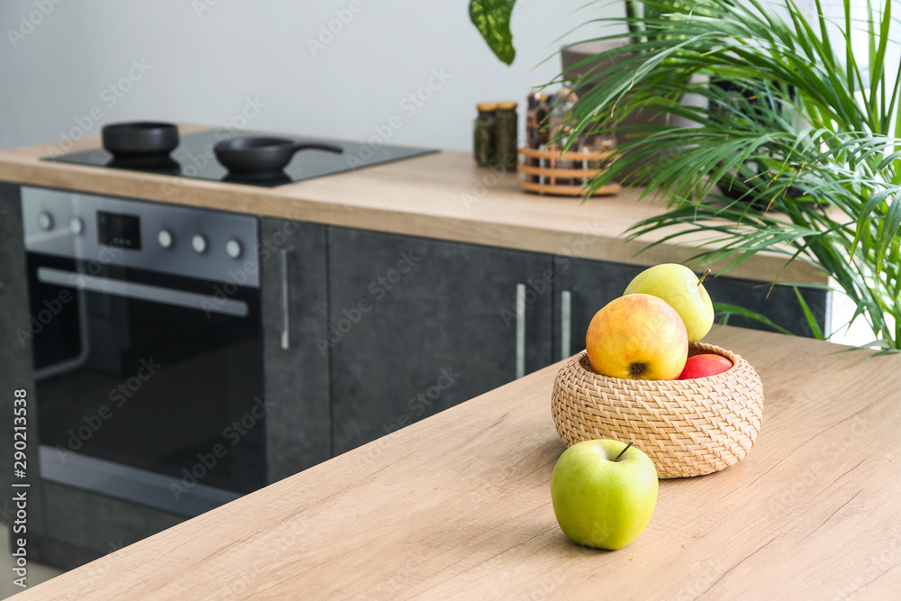 Apples on table in modern kitchen Apples on table in modern kitchen