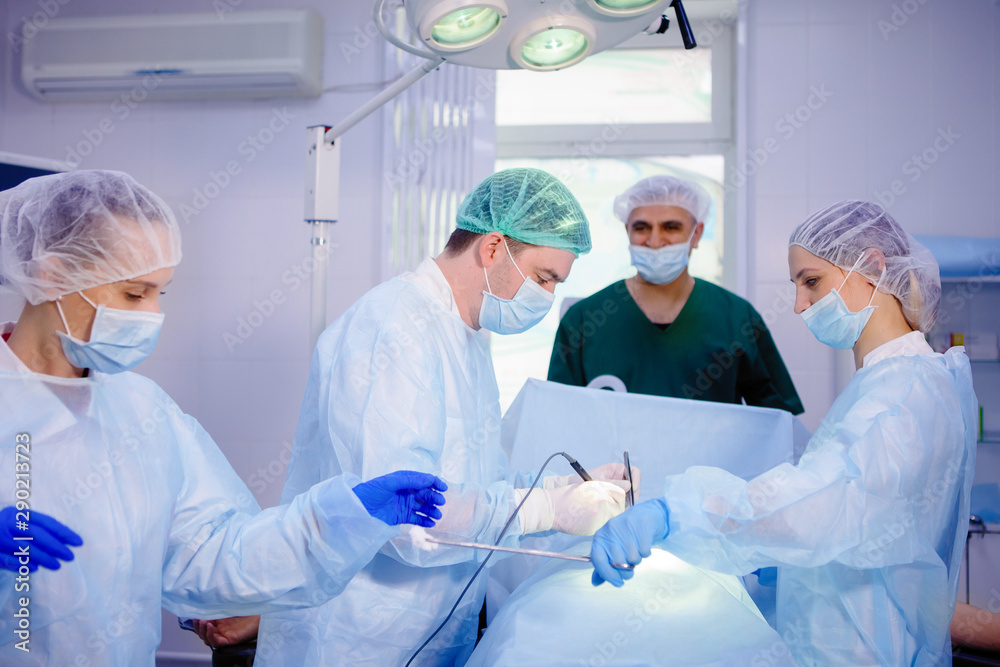 Team of surgeons doing surgery Team of surgeons doing surgery