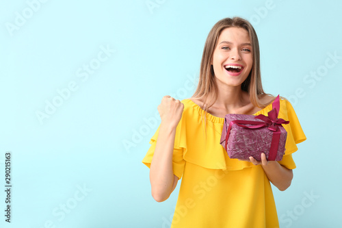 Happy woman with gift box o...