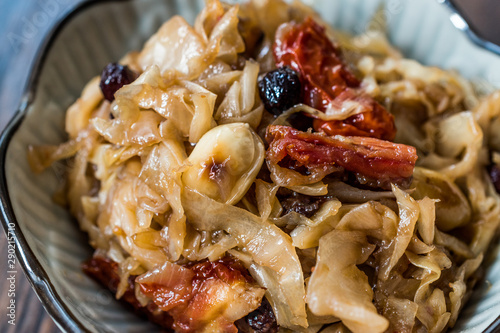 Cabbage Salad with Caramelized Onions, Dried Tomatoes and Currants. photo