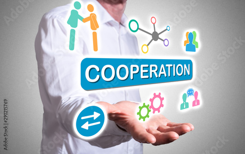 Cooperation concept above a human hand