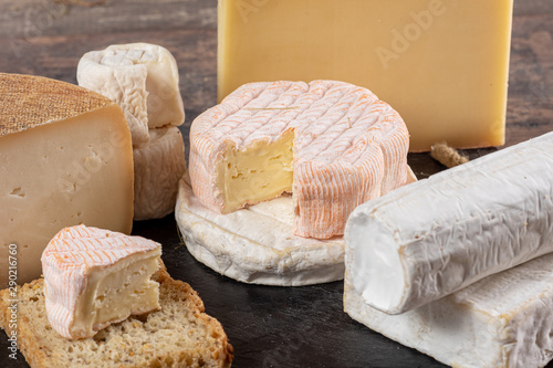 different delicious French cheeses on straw