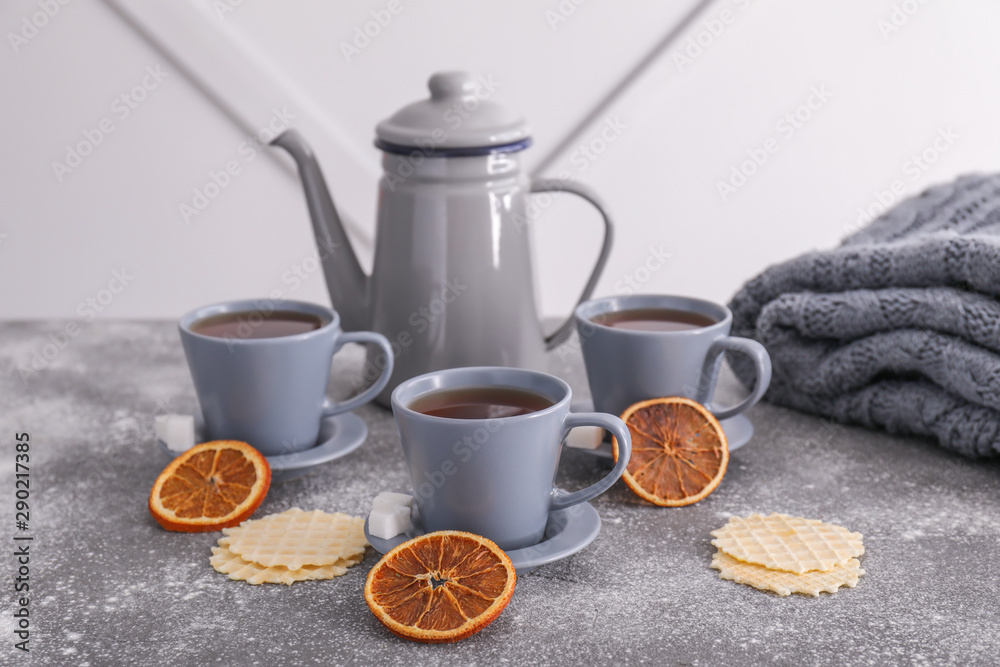 Composition with hot tea and waffles on table Composition with hot tea and waffles on table