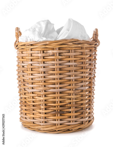 Basket with laundry on white background