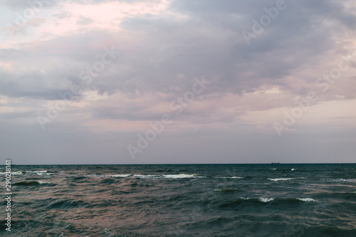 Sea landscape with waves on the water in pastel colors