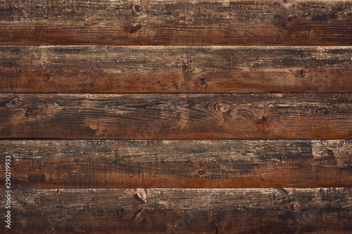 Cracked wood background. Brown old wooden planks. Horizontal lines on fence. Vintage rustic pattern. Timber plank, scratched surface. Dirty wall, grunge texture. Shabby table. Vintage style.