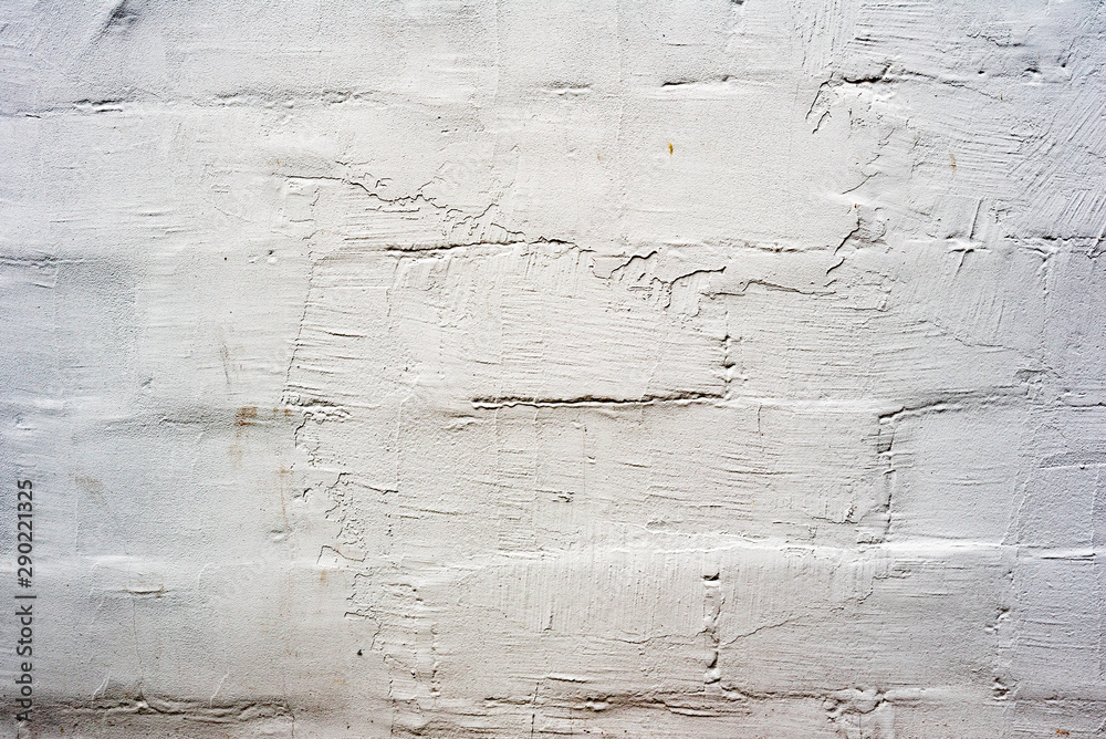 Obraz premium Texture of a brick wall with cracks and scratches which can be used as a background