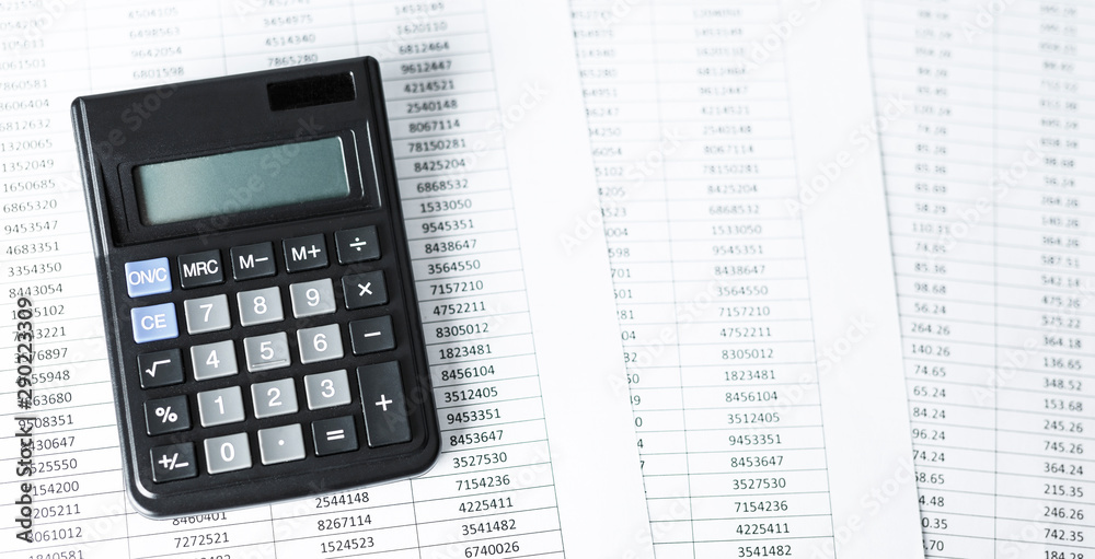 Calculator on white paper with numbers. Business and Finance accounting concept. Calculator on white paper with numbers. Business and Finance accounting concept.