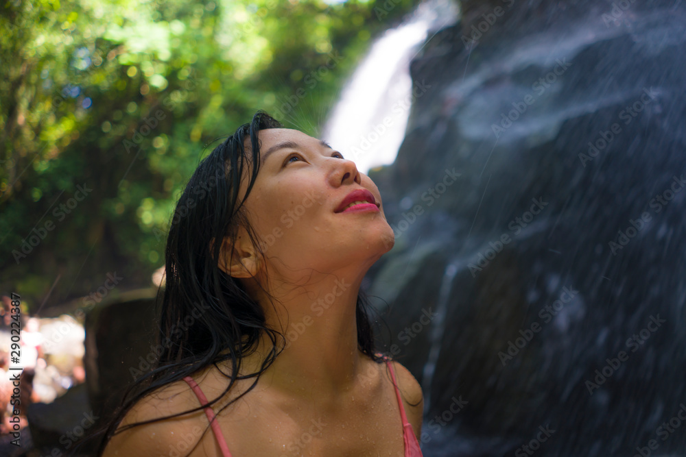 outdoors Summer holidays lifestyle portrait of young happy and beautiful Asian Chinese woman in bikini enjoying at tropical paradise waterfall feeling free and relaxed outdoors Summer holidays lifestyle portrait of young happy and beautiful Asian Chinese woman in bikini enjoying at tropical paradise waterfall feeling free and relaxed