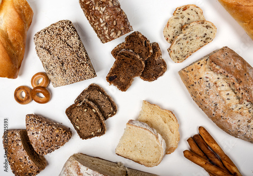 Different types of bread on a white background. Top view.