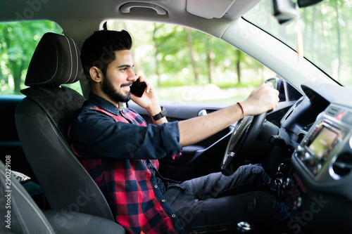 Indian man on mobile phone while drive his car on the road © F8  \ Suport Ukraine