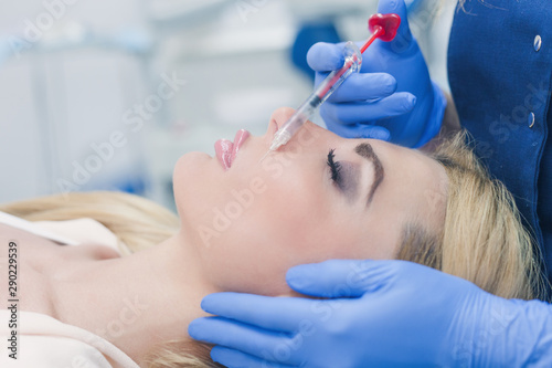 woman at beauty and health clinic hyaluronic acid injection