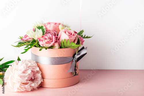 фотографія Beautiful and tender bouquet of flowers in the hat box,