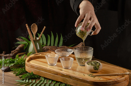 tea table with instruments teapots cups and tea Shen Puer