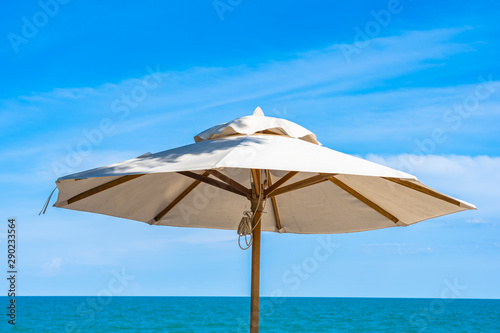 Beautiful umbrella and chair around beach sea ocean with blue sky for travel © siraphol
