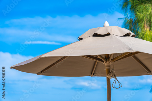 Beautiful umbrella and chair around beach sea ocean with blue sky for travel © siraphol
