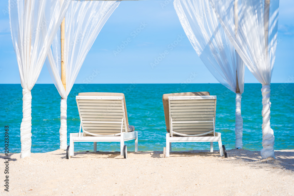 Obraz premium Beautiful umbrella and chair around beach sea ocean with blue sky for travel