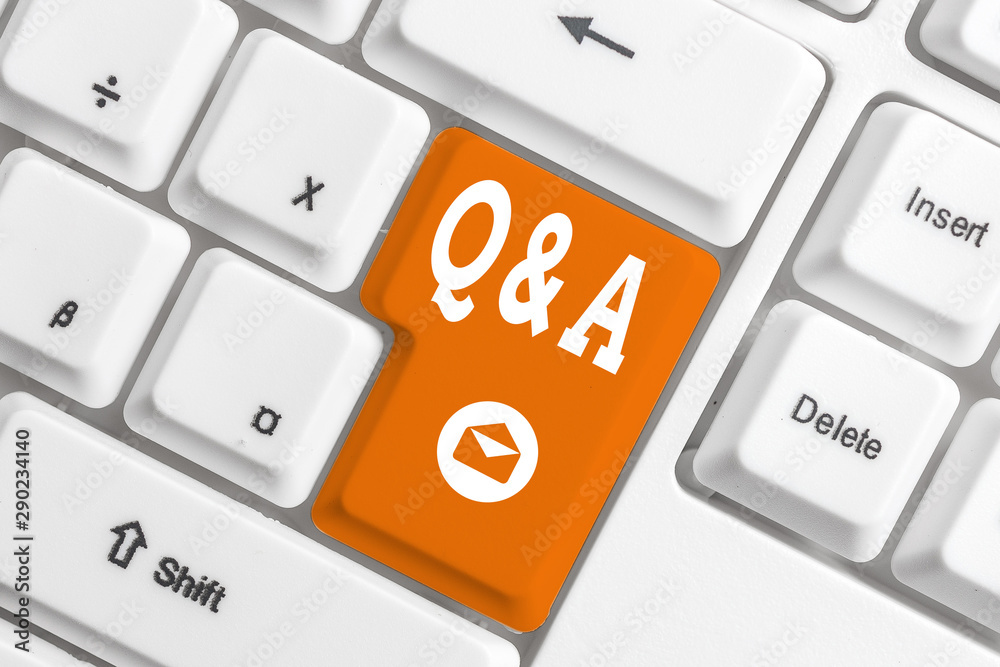 Conceptual hand writing showing Q And A Question. Concept meaning in which demonstrating asks questions and another one answers them White pc keyboard with note paper above the white background Conceptual hand writing showing Q And A Question. Concept meaning in which demonstrating asks questions and another one answers them White pc keyboard with note paper above the white background