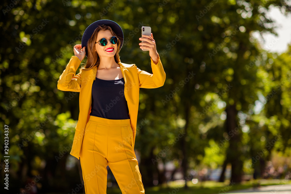 Portrait of her she nice-looking gorgeous attractive lovely pretty cheerful confident trendy fashionable girl taking making selfie on fresh air in green forest wood outdoors
