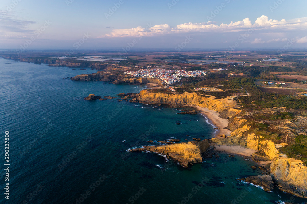 Aerial view of the beautiful Alteirinhos Beach at Zambujeira do Mar, Alentejo, at sunset. Aerial view of the beautiful Alteirinhos Beach at Zambujeira do Mar, Alentejo, at sunset.