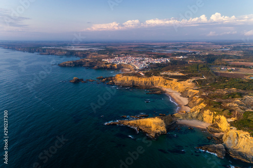 Aerial view of the beautiful Alteirinhos Beach at Zambujeira do Mar, Alentejo, at sunset. photo