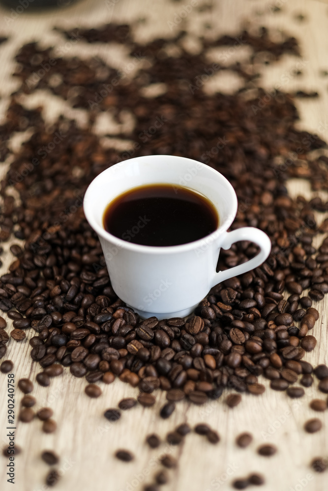 Black coffee, Espresso in a cup of coffee and coffee beans background. Black coffee, Espresso in a cup of coffee and coffee beans background.