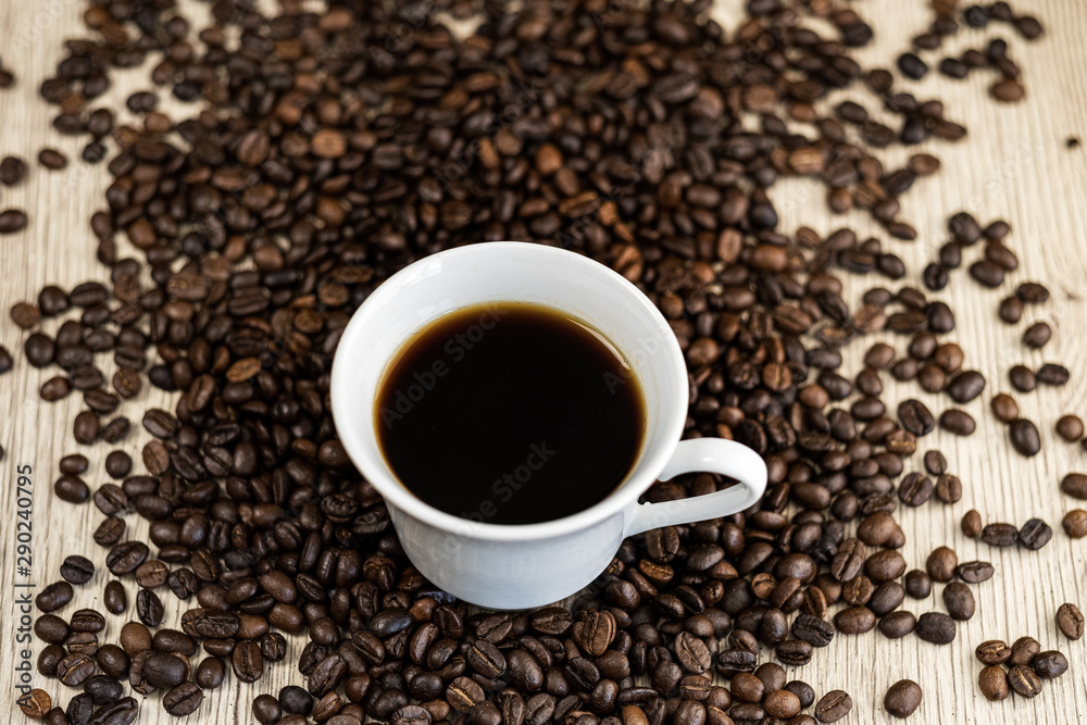 Black coffee, Espresso in a cup of coffee and coffee beans background. Black coffee, Espresso in a cup of coffee and coffee beans background.
