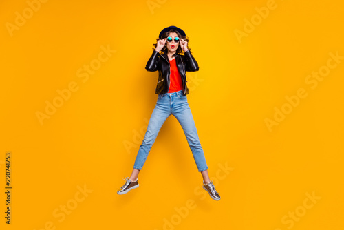 Unbelievable season sales! Full length photo of astonished girl touch her spectacles jump wear modern outfit denim jeans isolated over yellow color background