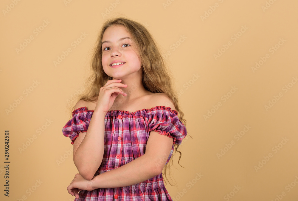 Pure beauty. beautiful little girl fashion model. small kid in dress. happy small girl with long healthy hair. hair health and care. hairdresser salon. beauty. kid fashion. long blond curly hair Pure beauty. beautiful little girl fashion model. small kid in dress. happy small girl with long healthy hair. hair health and care. hairdresser salon. beauty. kid fashion. long blond curly hair