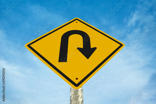u-turn traffic  sign  with blue sky background