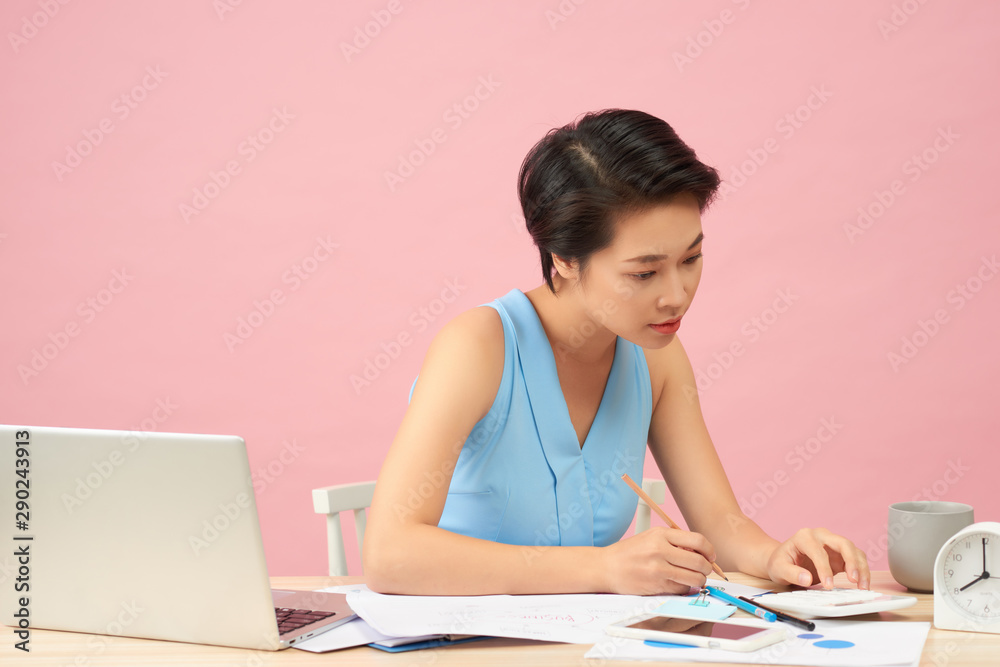 Beautiful young Asia woman working in office Beautiful young Asia woman working in office