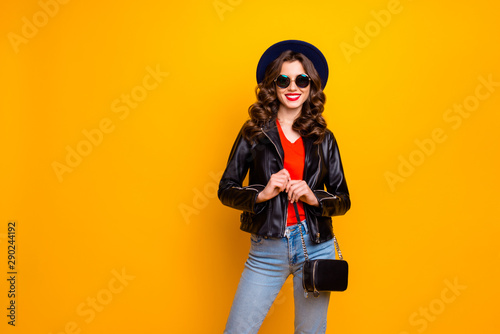 Photo of excited attractive lady ready for voyage to sales and discounts wear stylish outfit with shoulder clutch isolated yellow background