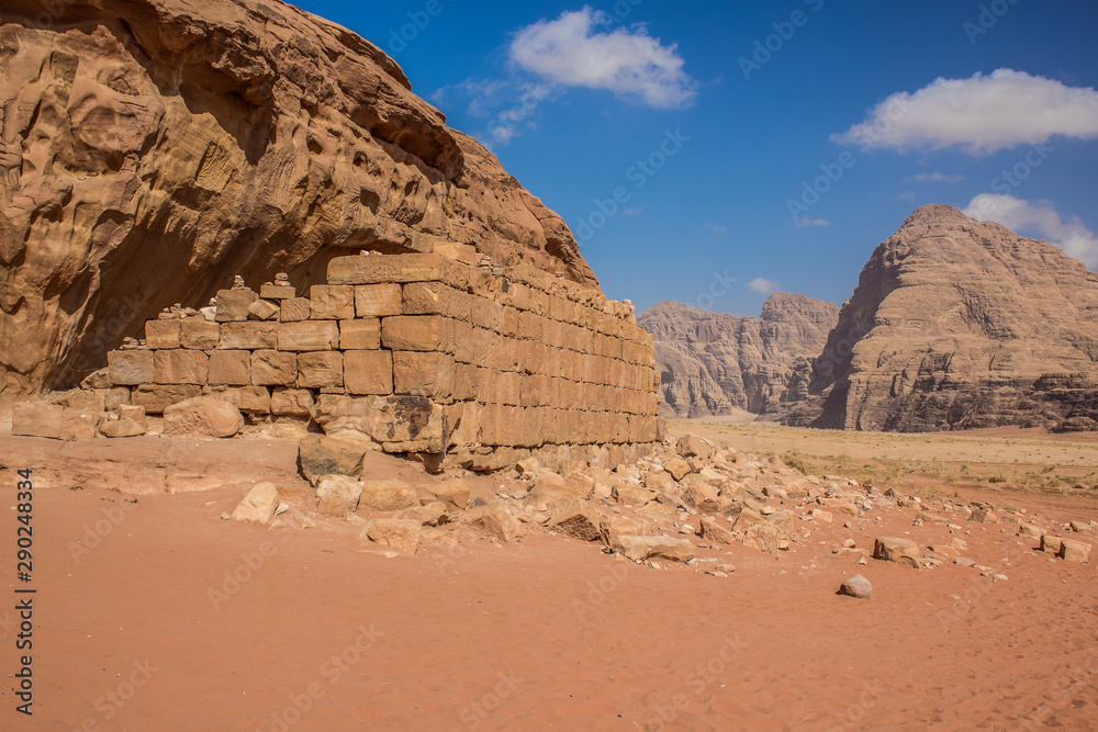 unknown abandoned ruin of brick building in desert warm rocky wasteland dry environment, Middle East war concept picture  