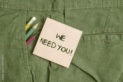 Conceptual hand writing showing We Need You. Concept meaning asking someone to work together for certain job or target Writing equipment and pink note paper inside pocket of trousers