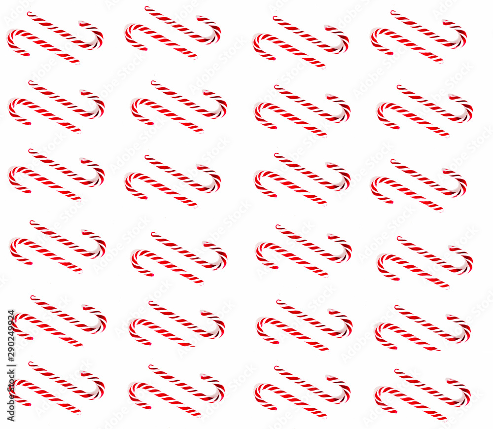 Christmas candy cane pattern on blue white background. Flat lay and top view Christmas candy cane pattern on blue white background. Flat lay and top view