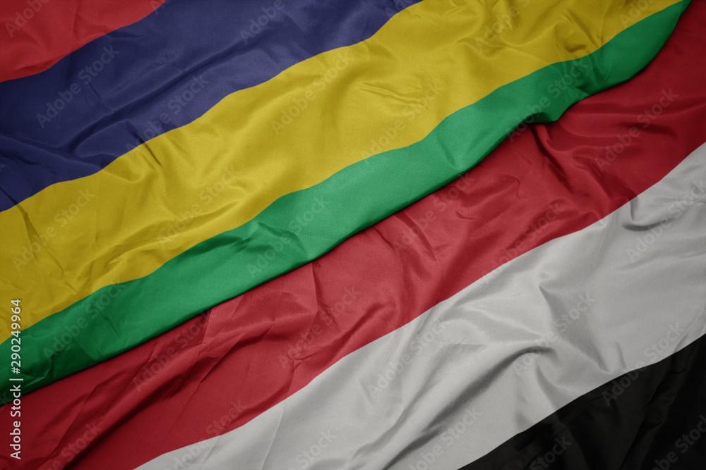 waving colorful flag of yemen and national flag of mauritius. waving colorful flag of yemen and national flag of mauritius.