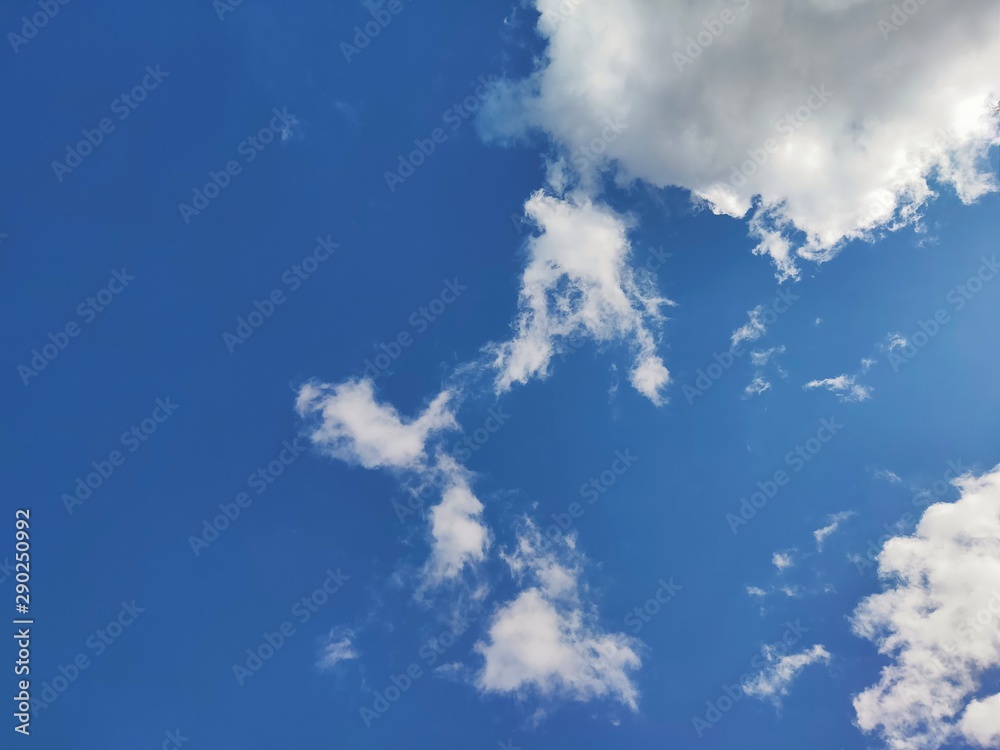 The blue sky with white clouds floating on space. The blue sky with white clouds floating on space.