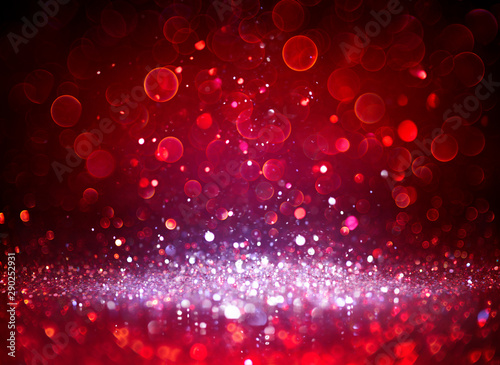 Silver Glitter Sparkling In Red Blurred Background