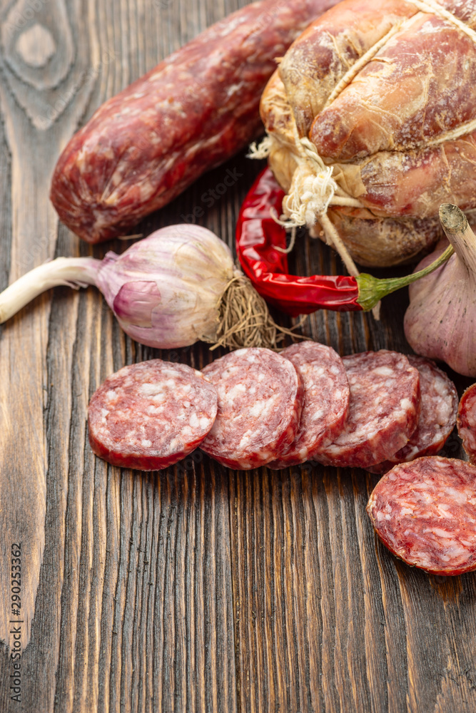 Display of a variety of seasoned ham and smoked sausages