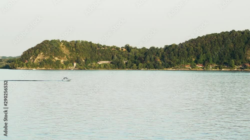 Small speedboat on Lake Maggiore perfectly tracked by camera with navigating at full speed Small speedboat on Lake Maggiore perfectly tracked by camera with navigating at full speed