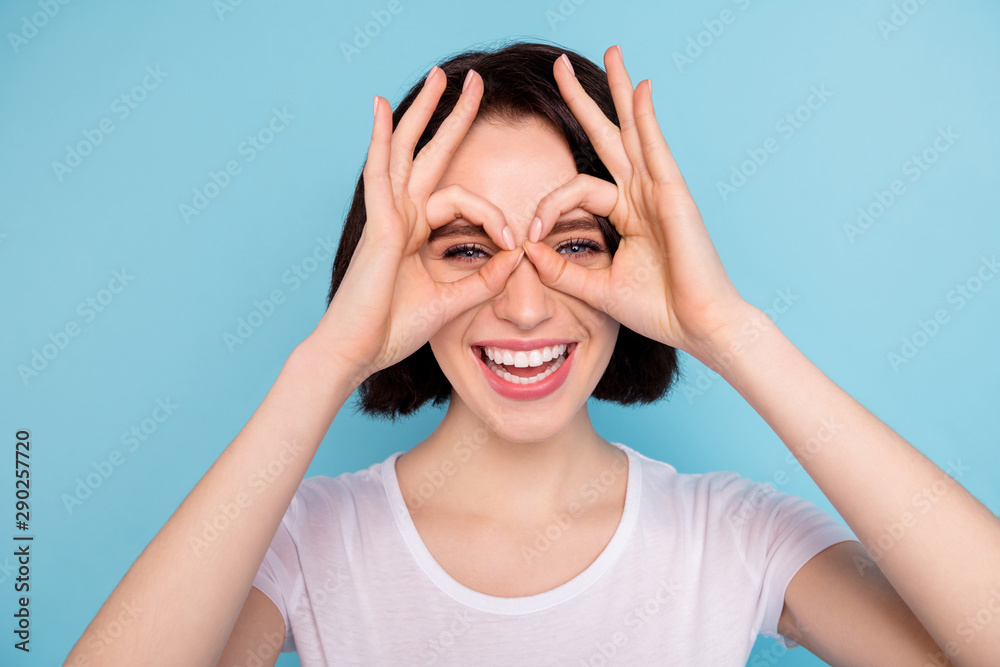 Close-up portrait of her she nice attractive lovely cheerful cheery funky positive girl showing two double ok-sign like specs isolated on bright vivid shine vibrant blue turquoise color background Close-up portrait of her she nice attractive lovely cheerful cheery funky positive girl showing two double ok-sign like specs isolated on bright vivid shine vibrant blue turquoise color background