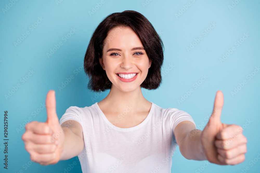 Close-up portrait of her she nice attractive cheerful cheery glad girl showing two thumbup best decision solution advice isolated on bright vivid shine vibrant blue turquoise color background Close-up portrait of her she nice attractive cheerful cheery glad girl showing two thumbup best decision solution advice isolated on bright vivid shine vibrant blue turquoise color background
