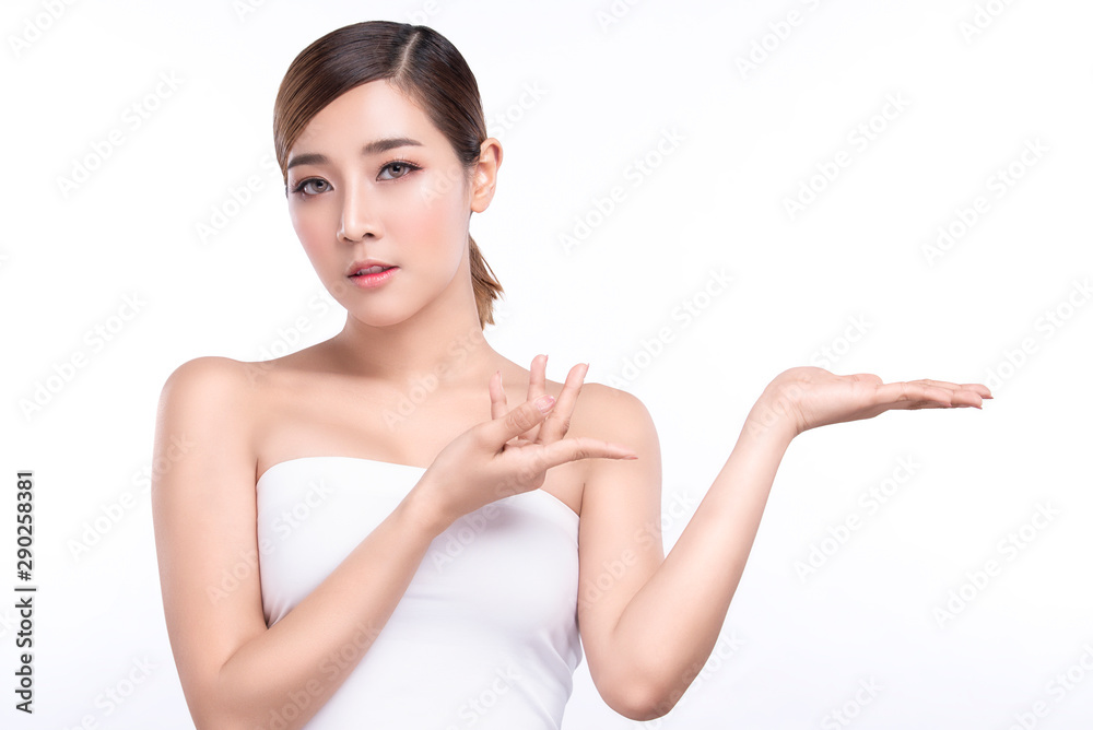 Beauty young asian woman showing hand for product on white background. treatment & Skin care concept. Beauty young asian woman showing hand for product on white background. treatment & Skin care concept.