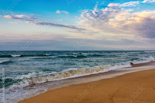 Beach with a wavy beautiful sea